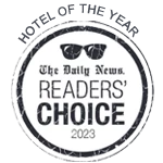 This image shows a badge with the text "HOTEL OF THE YEAR," "The Daily News READERS' CHOICE 2023," and sunglasses graphic in the center. logo on footer section.